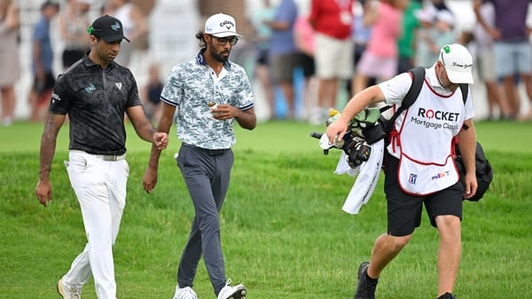 Aaron Rai and Akshay Bhatia walk together along the third tee box during the third round