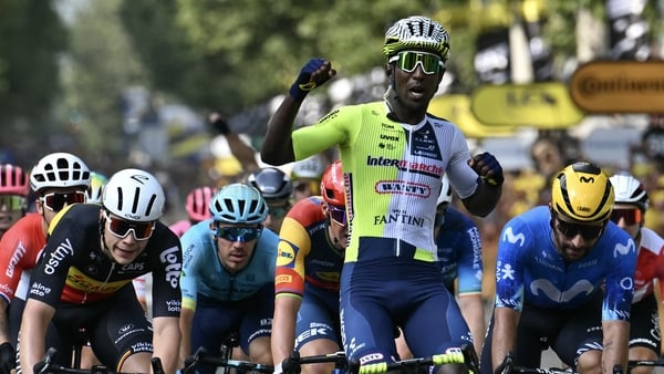 Biniam Girmay celebrates as he wins the bunch sprint