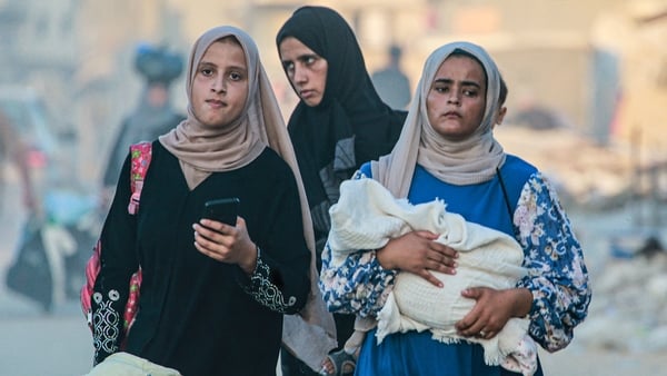 Palestinian women leaving an area in east Khan Yunis following an Israeli evacuation order