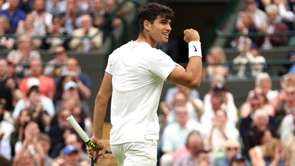 Carlos Alcaraz salutes the crowd during his battle with Aleksandar Vukic