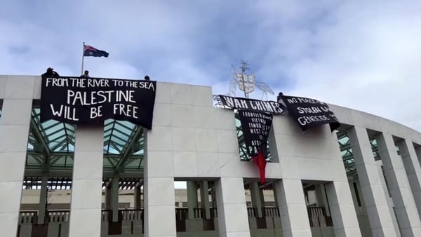 Footage showed four people dressed in dark clothes on the roof of the building