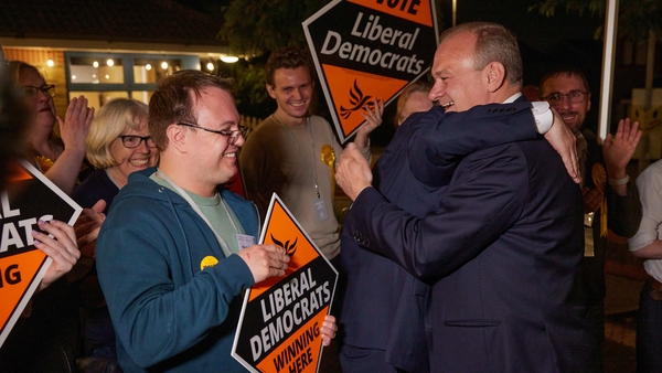 Liberal Democrat supporters greet Sir Ed Davey as he arrives at the results of his constituency's vote count during the UK general election