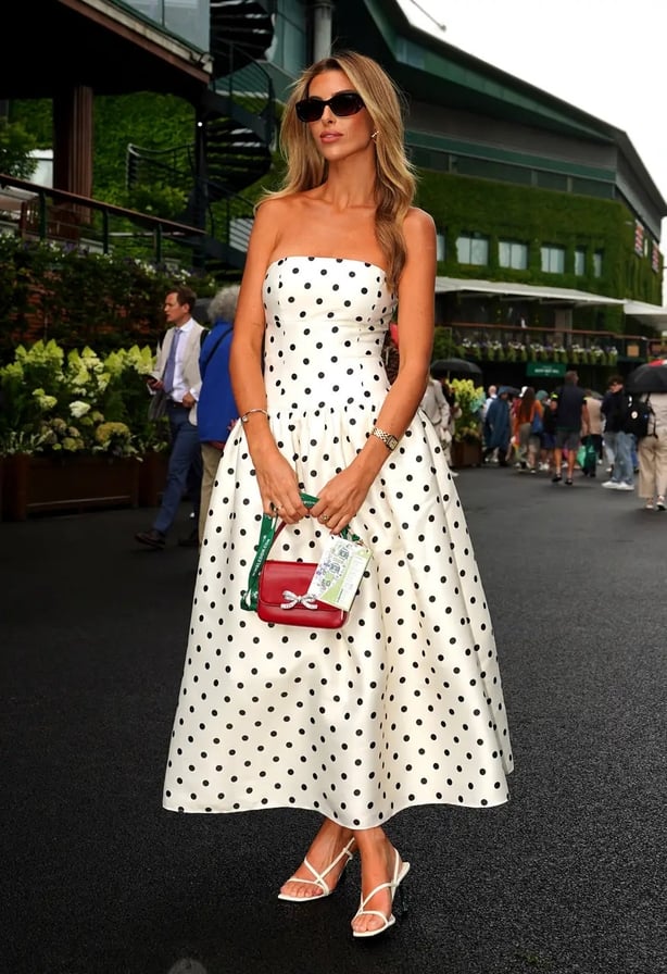 Paige Lorenze wore a classic polka-dot dress with a trendy drop hem waist (Zac Goodwin/PA)