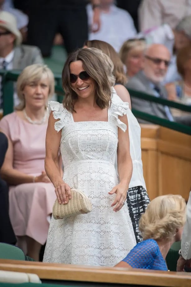 Pippa Middleton, sister of the Princess of Wales, wore a simple square-neck sundress to Wimbledon 2018 (Alamy/PA)