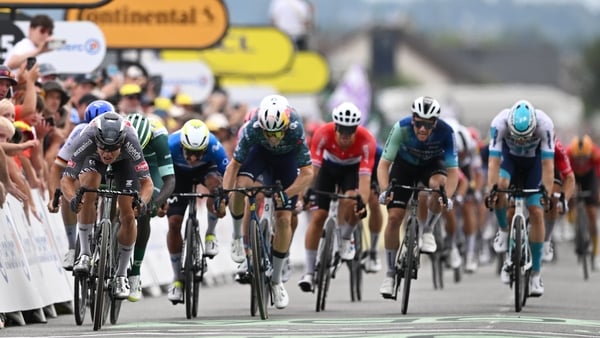 L-R) Stage winner Jasper Philipsen, Biniam Girmay, Wout Van Aert and Sam Bennett sprint towards the finish line on stage 10