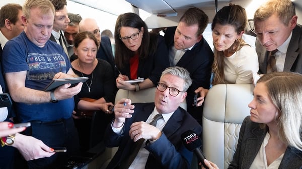 Keir Starmer talks to journalists as he travels to Washington DC