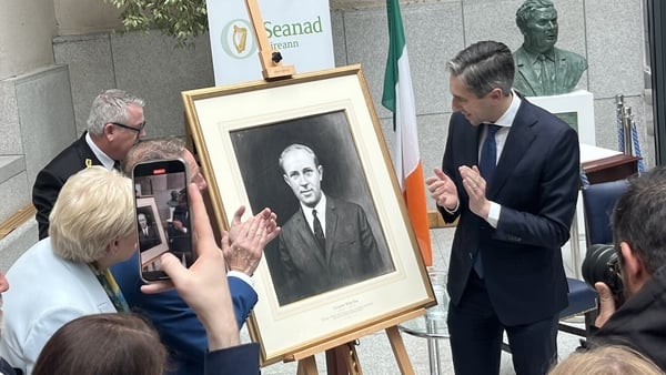 Taoiseach Simon Harris unveils the portrait of Senator Billy Fox at Leinster House