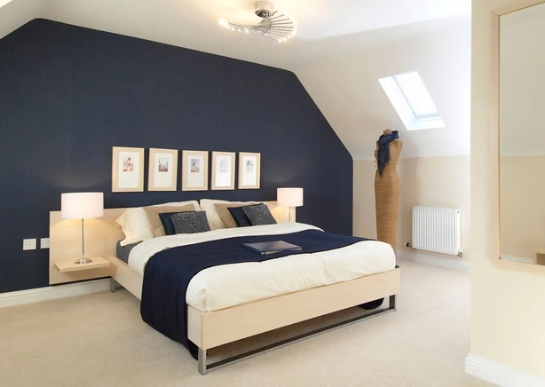 A feature wall in navy blue makes a striking focal point (Alamy/PA)