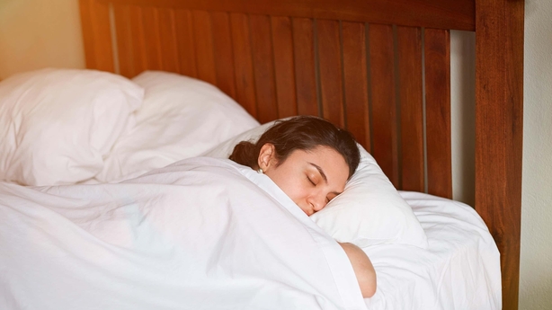 A woman sleeping in bed