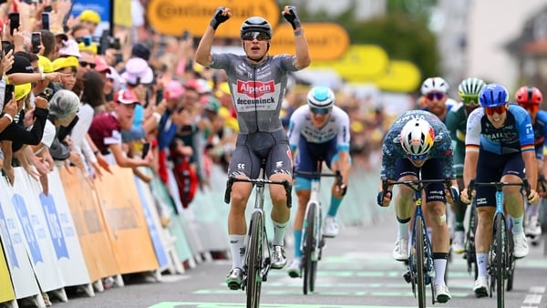 Jasper Philipsen celebrates at finish line as stage winner ahead of Wout van Aert