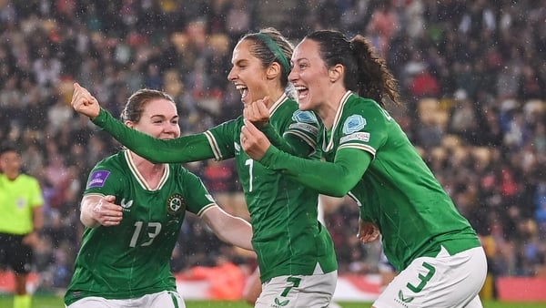 Julie-Ann Russell (C) celebrates her goal with Aoife Mannion and Megan Campbell