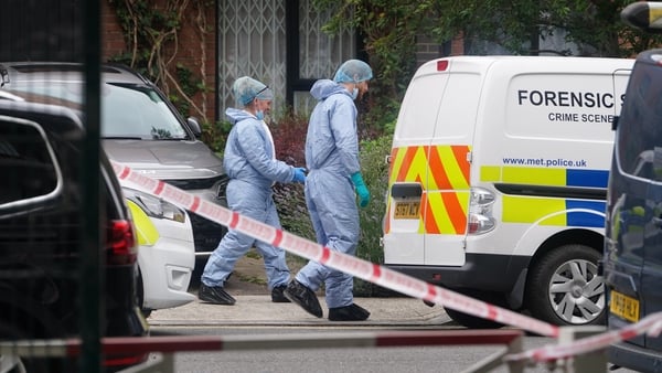 Forensic officers at an address in Shepherd's Bush, west London, after human remains were found in two suitcases in Bristol