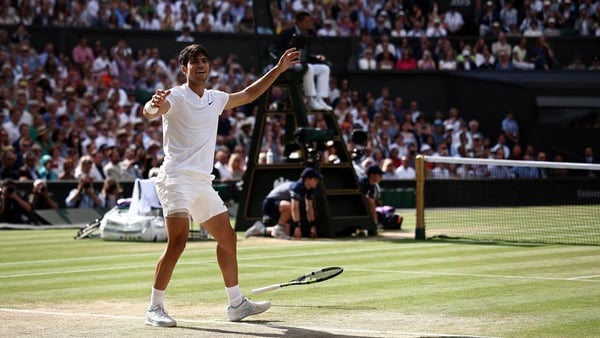 Carlos Alcaraz reacts after match point in his final defeat of Novak Djokovic