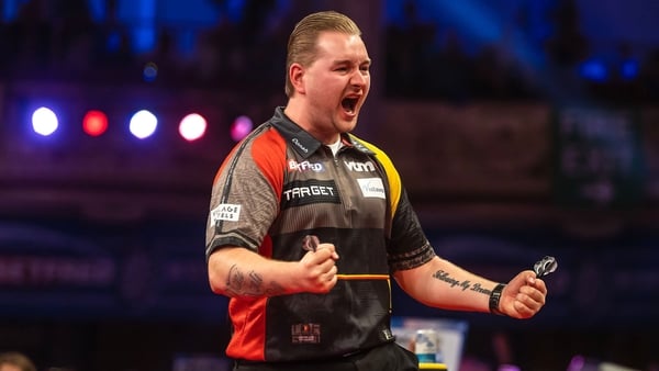 2020 winner Dimitri van den Bergh is through to the second round of the Betfred World Matchplay in Blackpool