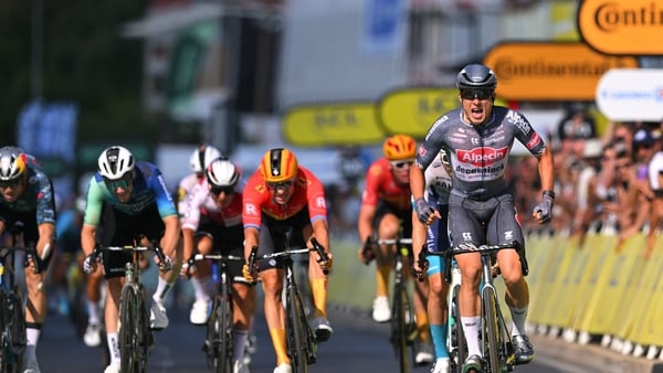 (L-R) Wout Van Aert, Sam Bennett, Alexander Kristoff and a Jasper Philipsen poised to celebrate his stage win cross the line at Nimes