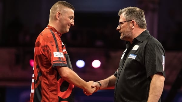 James Wade (r) knocked out defending champion Nathan Aspinall