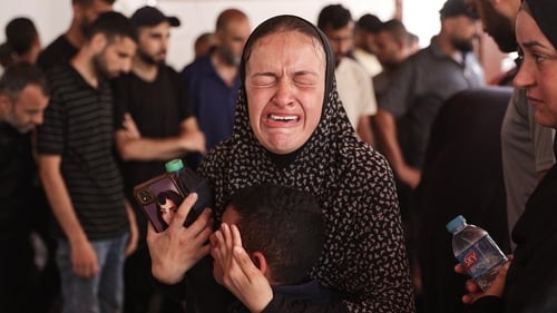 A Palestinian woman mourns a family member killed in an Israeli bombardment at al-Maamadani Hospital in Gaza city