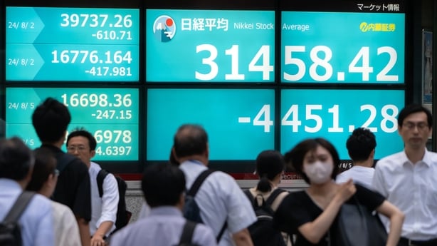 Japan's benchmark Nikkei average closed 12.40% lower at 31,458.42, its largest one-day fall since October 1987