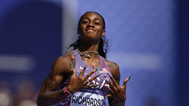 US' Sha'Carri Richardson celebrates after winning the women's 100m heat of the athletics eve