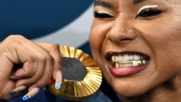 Jordan Chiles poses with the gold medal after the podium ceremony for the artistic gymnastics women's team final during the Paris 2024 Olympic Games