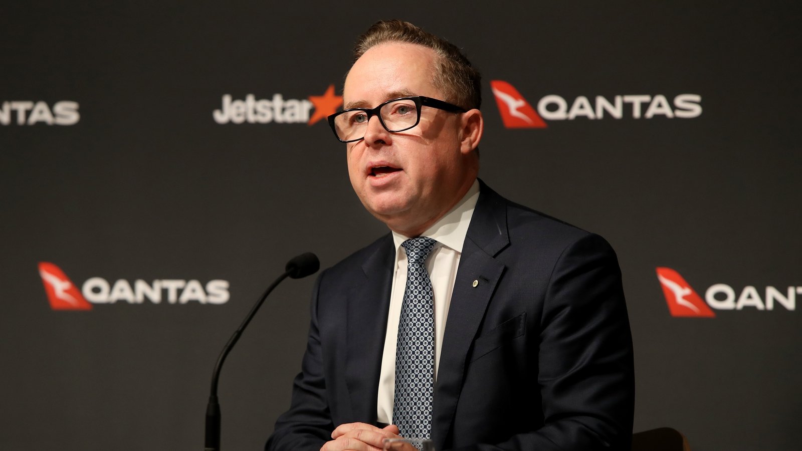 Qantas cuts former CEO’s exit pay after governance report