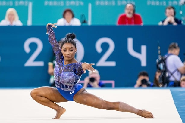 Simone Biles performs gymnastics routine with tight bun