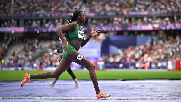Rhasidat Adeleke pictured mid-sprint in the women's 400m Olympic final in Paris