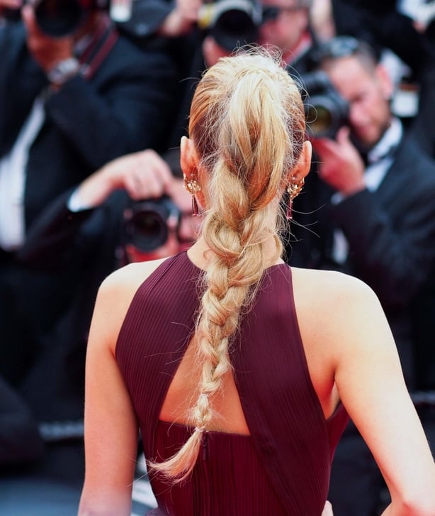 Blake Lively poses with hand on hip at red carpet at Cannes