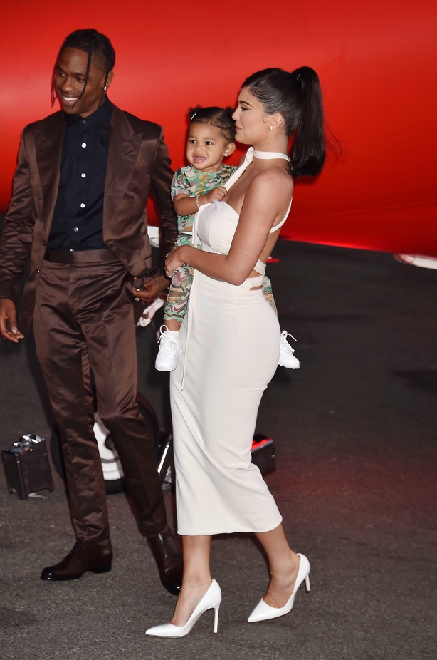 Travis Scott, Stormi Webster and Kylie Jenner attend the Travis Scott: "Look Mom I Can Fly" Los Angeles Premiere at The Barker Hanger in 2019