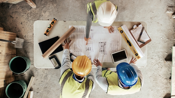 Shot of a young woman wearing a hardhat at work