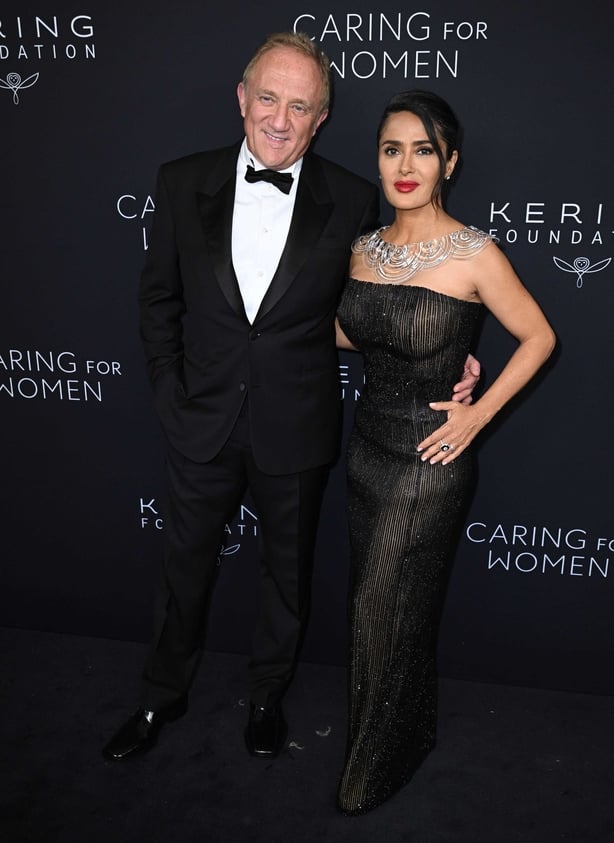 Hayek and Pinault pose on red carpet for Kering Foundation's Caring for Women dinner