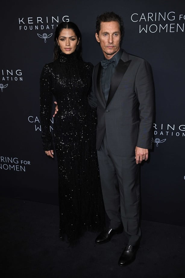 Camila Alves McConaughey (left) and Matthew McConaughey pose on red carpet for Kering Foundation's Caring for Women dinner