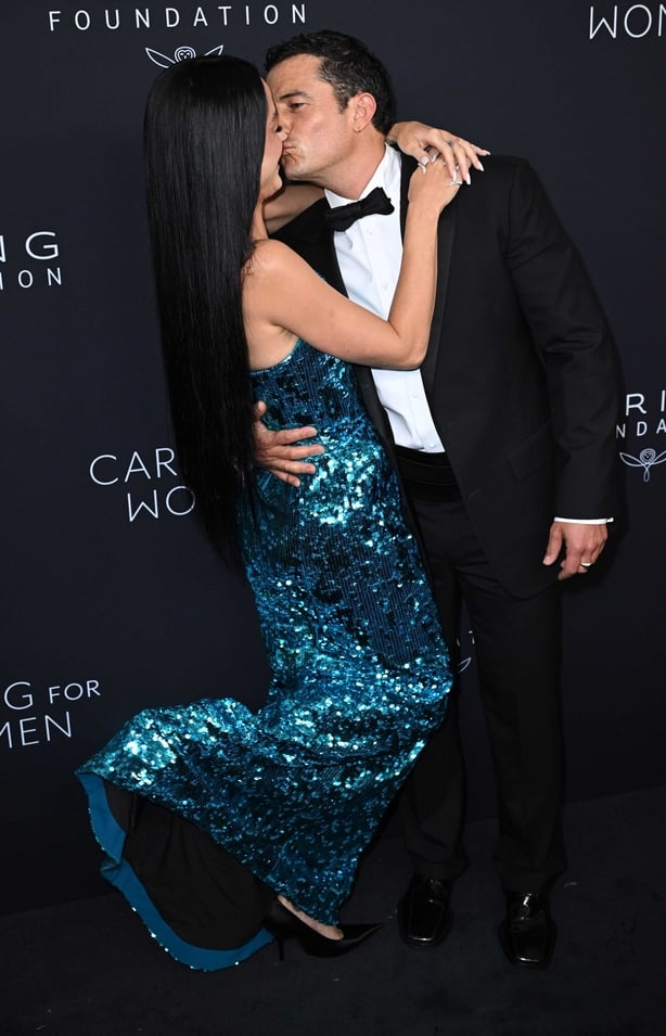 Katy Perry and Orlando Bloom kiss on Kering foundation red carpet