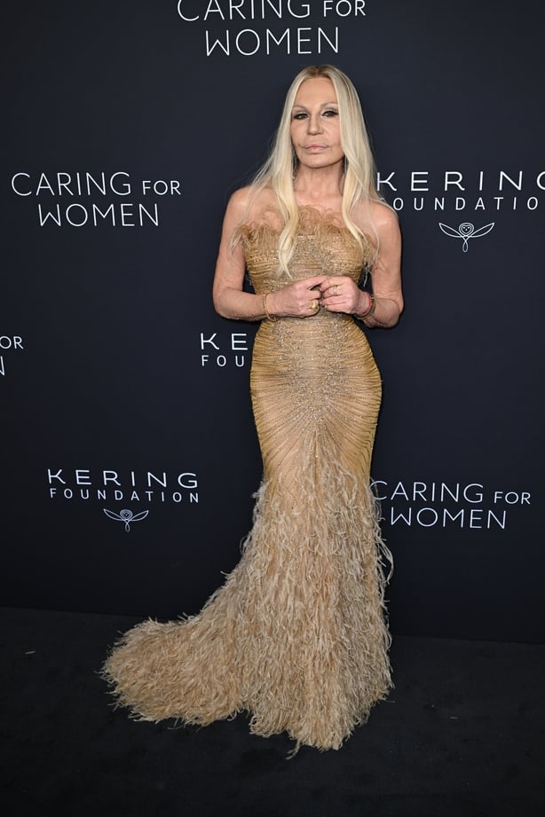 Donatella Versace poses on Kering Foundation's Caring for Women dinner red carpet