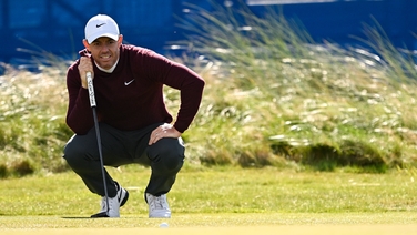 McIlroy's scrambling keeps him in touch
