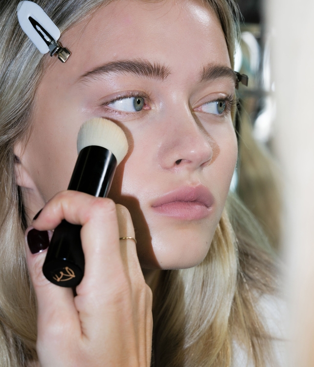 A model backstage at the JW Anderson show