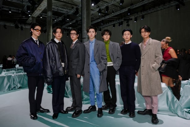 Members of the group ENHYPEN arrive for the Prada Spring Summer 2025 collection