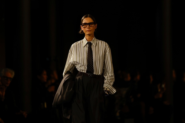A model wears a creation as part of the Saint Laurent Spring/Summer 2025 collection