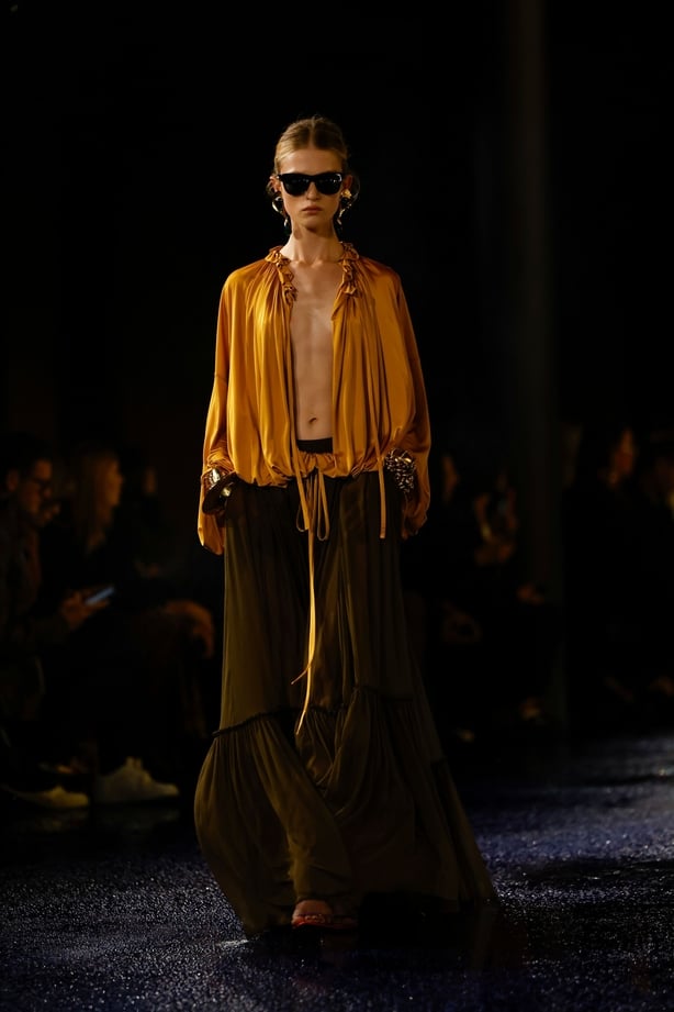 A model wears a creation as part of the Saint Laurent Spring/Summer 2025 collection