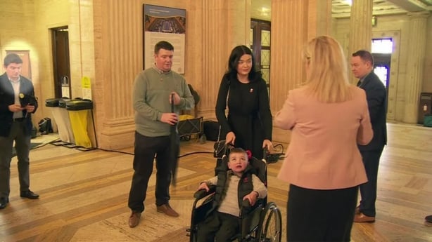 Michael McMonagle (highlighted far left) attended the same event as Michelle O'Neill (in pink jacket with her back to the camera)