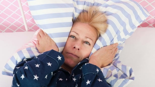 Blonde mature woman struggling to get to sleep