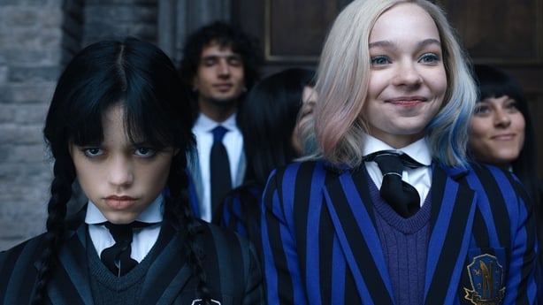 Wednesdya Addams frowns in school uniform