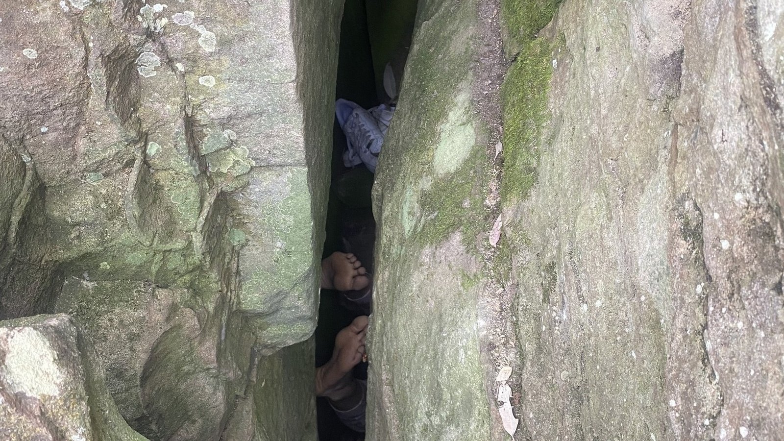 Woman freed after being stuck upside down in rock crevice