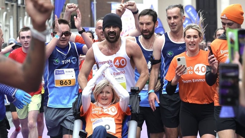 Colin Farrell and Emma Fogarty cross Dublin Marathon finish line
