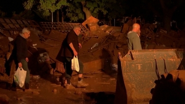 Residents clean up after flash floods as night falls on Spain's Utiel