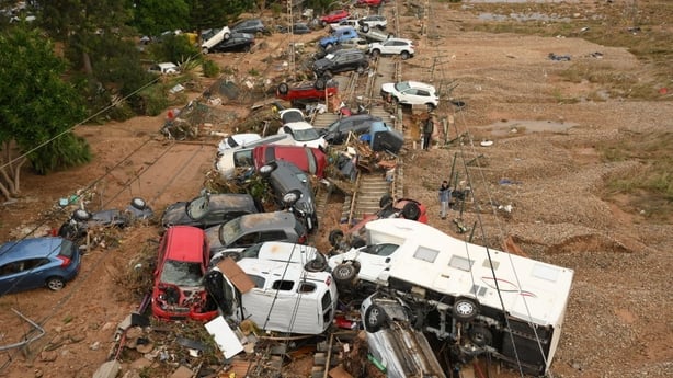 Cars strewn across railway tracks in Valencia following the flooding on 1 November