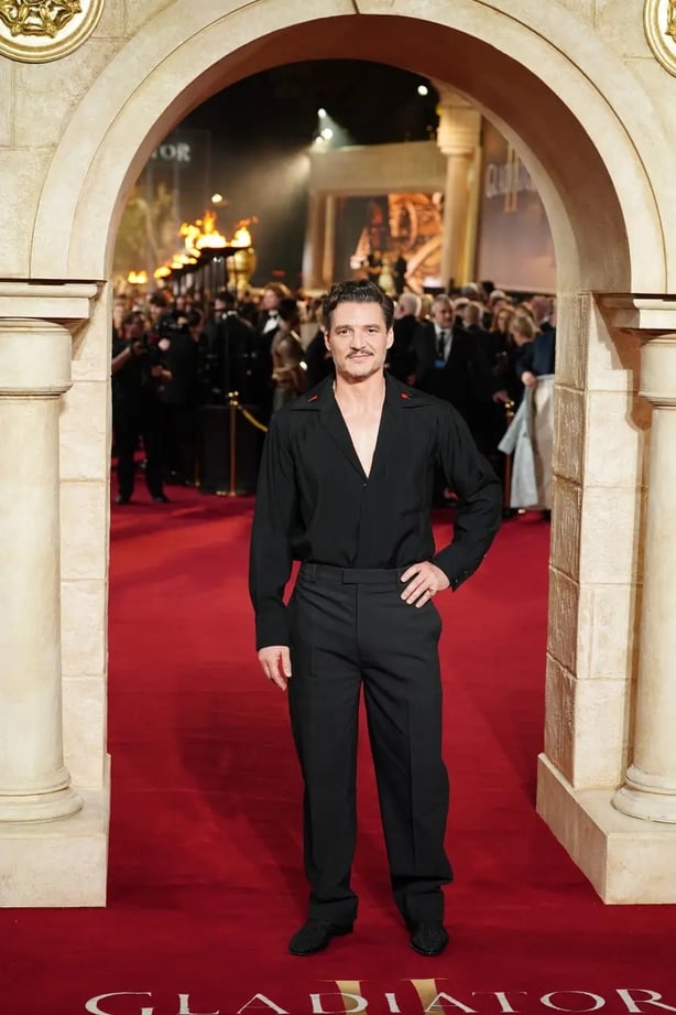 Pedro Pascal went all black in an open collar black shirt (Ian West/PA)