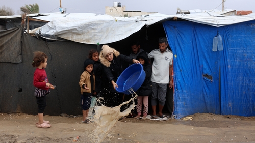 Storms flood tents in Gaza as Israel steps up bombardment