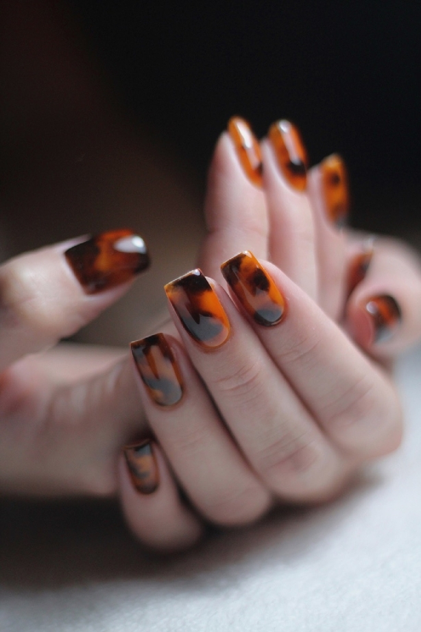 Model shows tortoiseshell set of nails