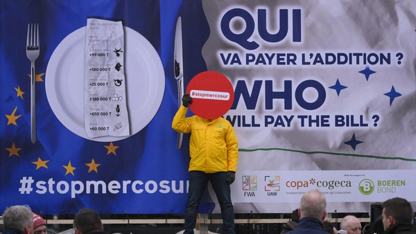 President of the Italian Young Farmers' Organisation Enrico Parisi holds a sign reading 'Stop Mercosur' during a protest in Brussels